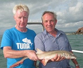 Peter Holt and Dave Chilton pose with their shared catch.